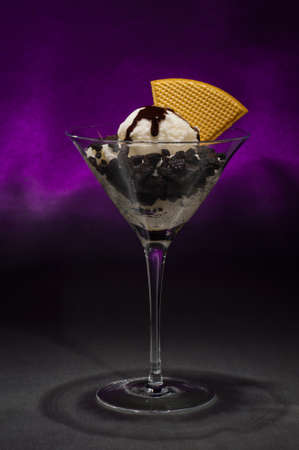 Cookies and ice cream in a Martini glass with with waffle decorationの写真素材