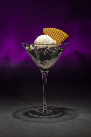 Cookies and ice cream in a Martini glass with with waffle decorationの写真素材