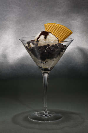 Cookies and ice cream in a Martini glass with with waffle decorationの写真素材
