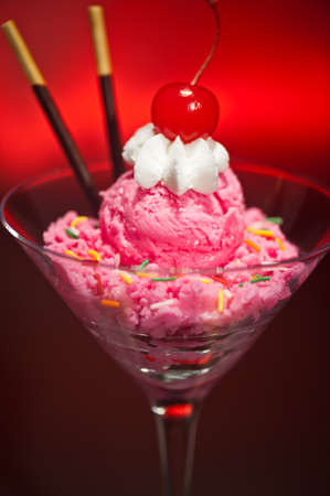 Raspberry ice cream in a Martini glass with with decorationの写真素材