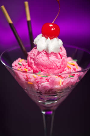 Raspberry ice cream in a Martini glass with with decorationの写真素材