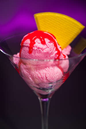 Raspberry ice cream in a Martini glass with with decorationの写真素材