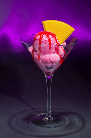 Raspberry ice cream in a Martini glass with with decorationの写真素材