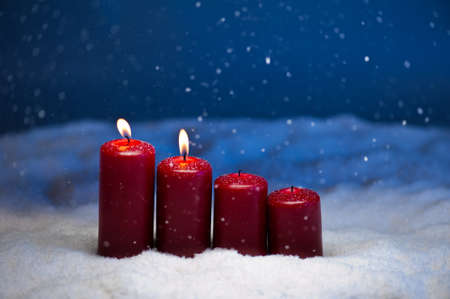 2nd Advent candles in snow and snowfallの写真素材