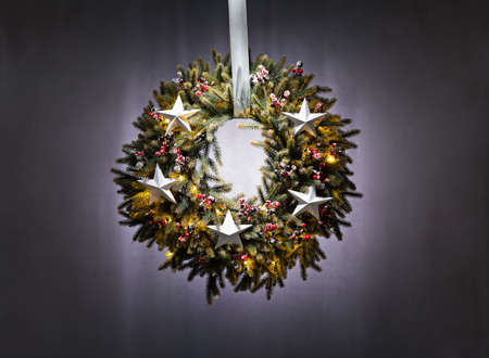 Advent wreath over silver grey background with starsの写真素材
