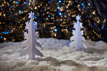 Paper cut christmas tree in snowy winter wonderlandの写真素材