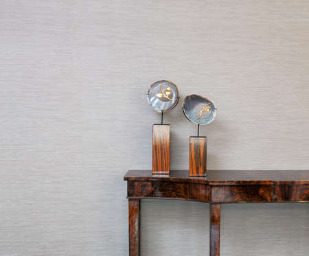 Sideboard in front of a grey wall with natural gem objectの写真素材