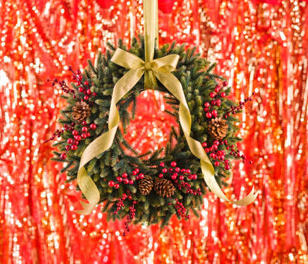 Green advents wreath with autumn decoration in front of a fiery backgroundの写真素材