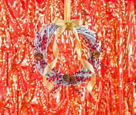 White advents wreath with autumn decoration in front of a fiery backgroundの写真素材