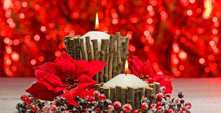 White candles in autumn winter decoration with real branch decorationの写真素材