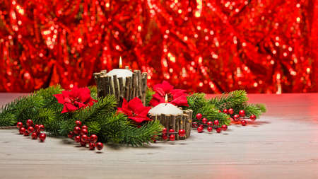 White candles in autumn winter decoration with real branch decorationの写真素材