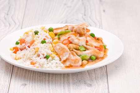 Chicken Cashew Rice dish over bright surfaceの写真素材