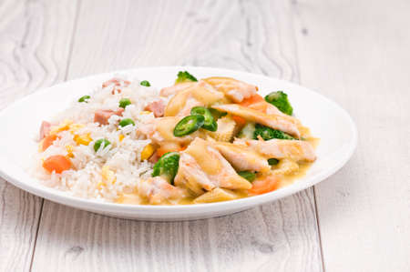 Thai Green Curry dish over bright surfaceの写真素材