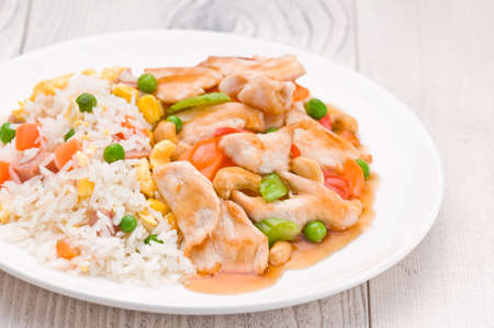 Chicken Cashew Rice dish over bright surfaceの写真素材