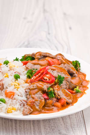 Thai Chili Beef dish over bright surfaceの写真素材