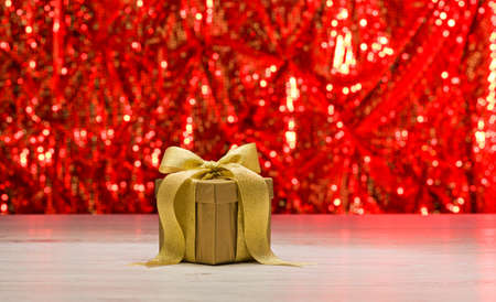 Gold present in front of a sparkling backgroundの写真素材