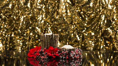 Autumn decorated candles in front of a gold backgroundの写真素材