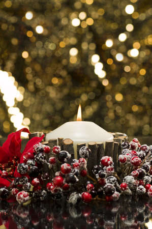 Autumn decorated candle in front of a gold backgroundの写真素材