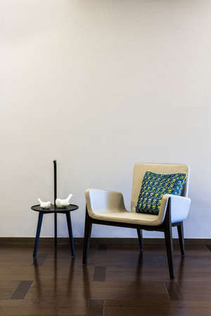 Table Grey Armchair combination in front of a plain wallの写真素材