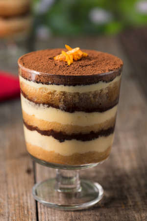 Tiramisu dessert on a wooden rustic table