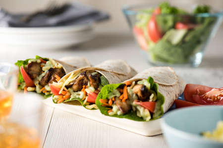 Grilled chicken with fresh vegetable burrito wrapsの写真素材