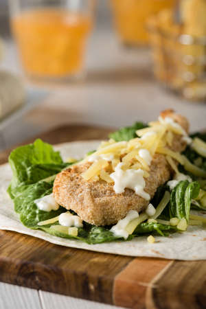 Crumbed Chicken Tortilla Wrap With Fresh Lettuce Cheeseの写真素材