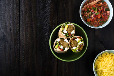 Vegetarian falafel wraps with avocado and cheeseの写真素材