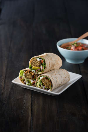 Vegetarian falafel wraps with avocado and cheeseの写真素材