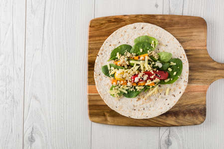 Grilled vegetables warps with quinoa, pumpkin, peppers and cheeseの写真素材