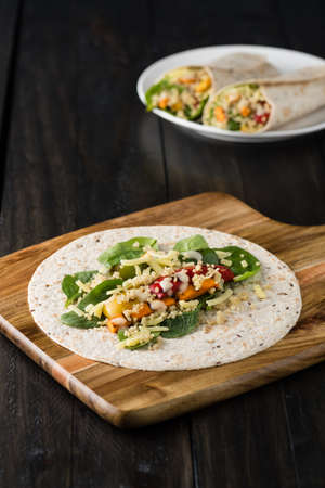 Grilled vegetables wraps with quinoa, pumpkin, peppers and cheeseの写真素材