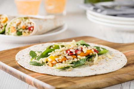 Grilled vegetables warps with quinoa, pumpkin, peppers and cheeseの写真素材