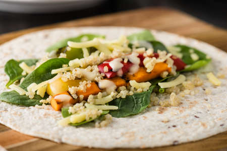 Grilled vegetables wraps with quinoa, pumpkin, peppers and cheeseの写真素材