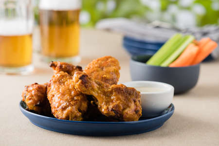 Hot wing with celery carrot sticks at beer gardenの写真素材