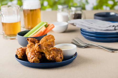 Hot wing with celery carrot sticks at beer gardenの写真素材