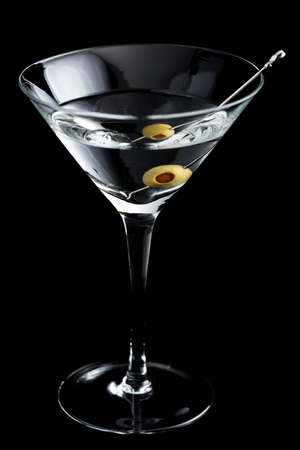 Vodka martin cocktail with olives on black backgroundの写真素材