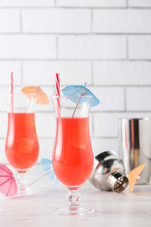 Fresh home made Singapore Sling with cocktails umbrellaの写真素材