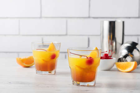 Fresh home made Mai Tai with orange and maraschino cherry garnishの写真素材