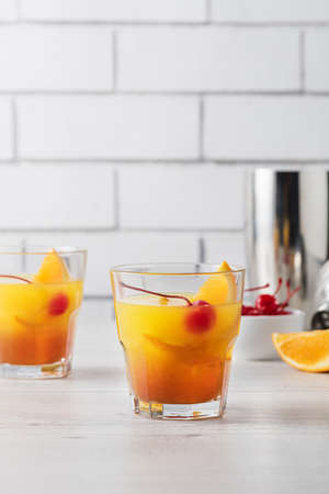 Fresh home made Mai Tai with orange and maraschino cherry garnishの写真素材