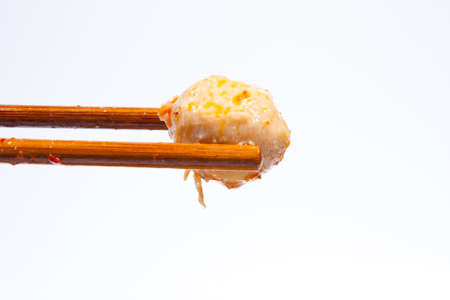 Ball is progress. Using chopsticks in bowl of noodles came from.の写真素材