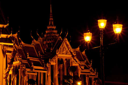 Wat Phra Kaeo in the evening. Red light bulb. The exotic atmosphere in the evening.のeditorial素材