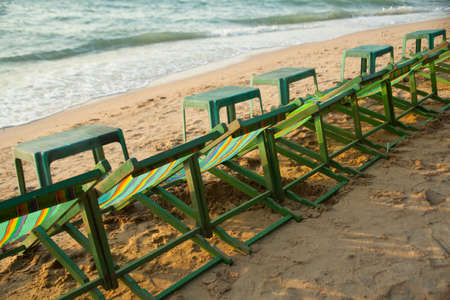 Seaside resort with a chair on the beach. Looking forward to the sea and sky.の写真素材