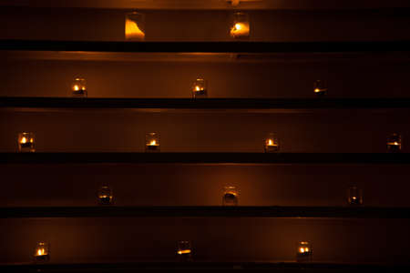 Light on the shelves. Light the lamp placed on a shelf in a row.の写真素材