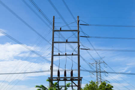 High voltage towers. The meadow below. Industry and nature coexist in appropriate Slightly cloudy...