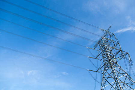 High voltage towers. The meadow below. Industry and nature coexist in appropriate Slightly cloudy...