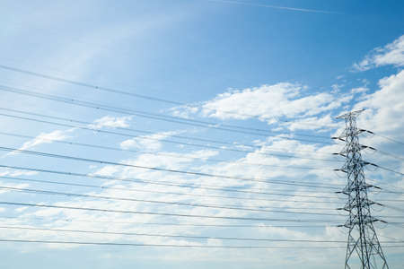 High voltage towers. The meadow below. Industry and nature coexist in appropriate Slightly cloudy...