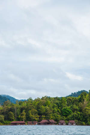 resort is in the river. Raft in the river. Attached to the tree-covered mountains and dense.の写真素材