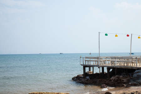 Restaurant by the sea. Located on the beach with tables and chairs for customers.の写真素材