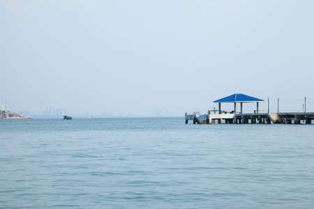 Bridges, pavilion, bridges and out to sea with the mountains in the background.