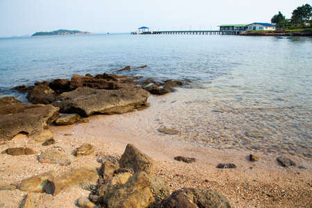 Beach and sea. The beaches of Koh Larn. Sand and sea with a ship moored in the calm sea.の写真素材