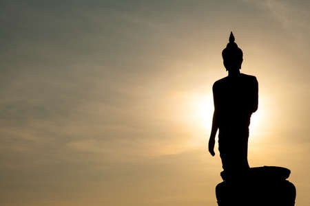 Larger Buddha. In the evening. The black silhouette of a Buddha statue.の写真素材